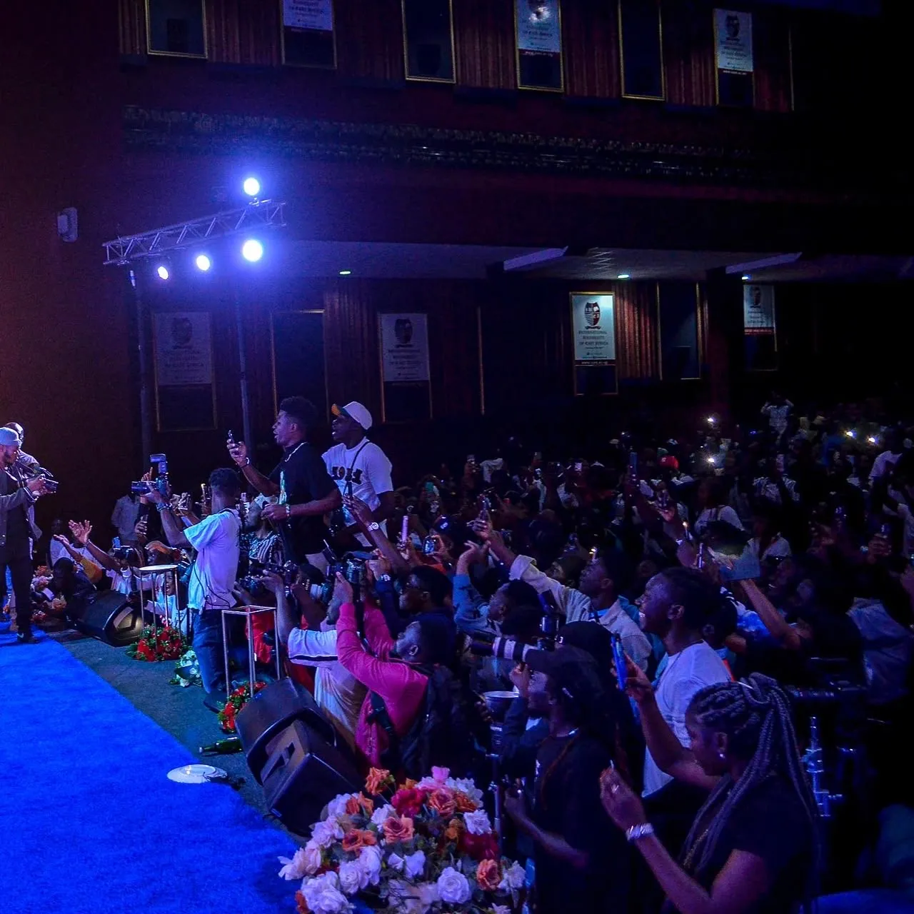 The venue was filled with an enthusiastic audience documenting the moment.
